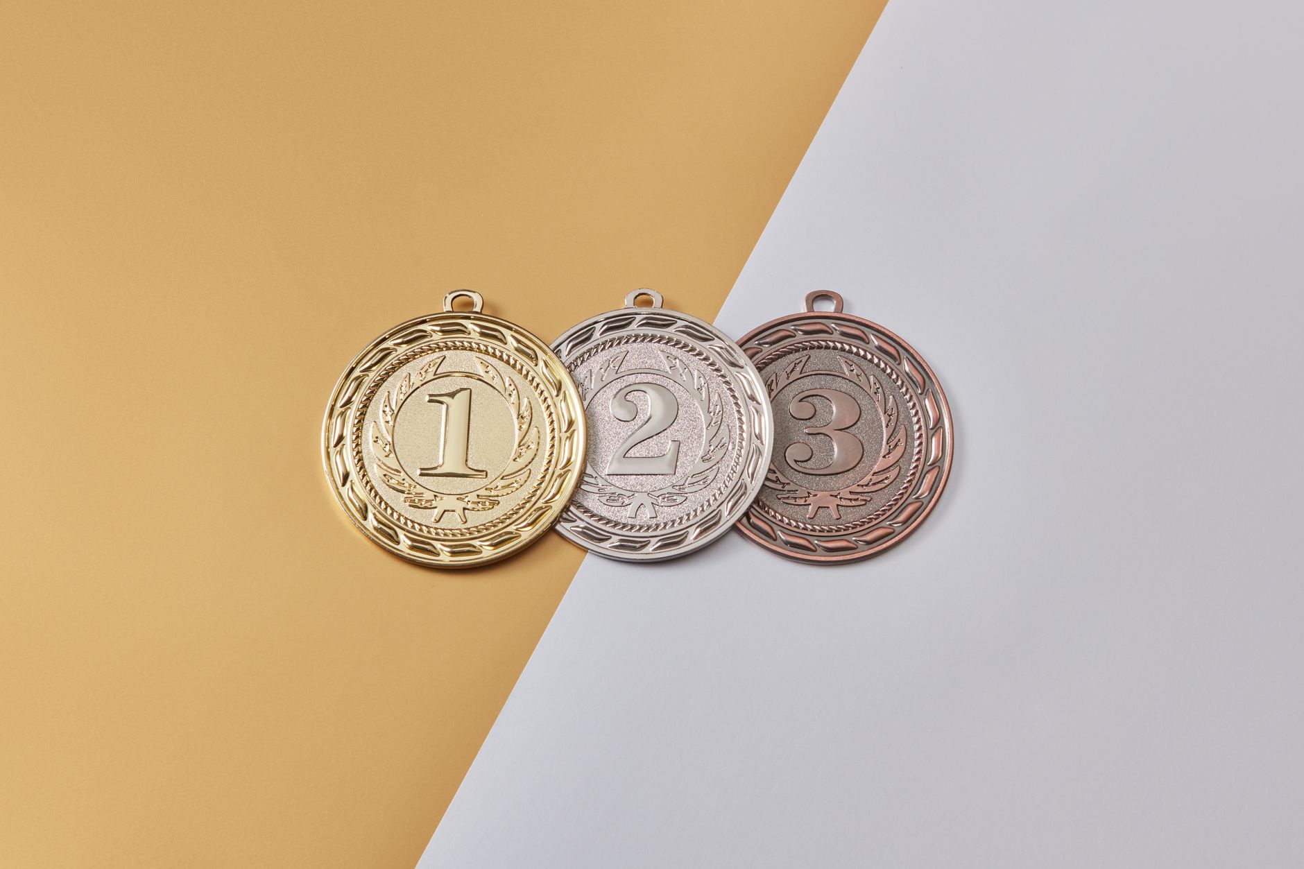 medals on a yellow and gray surface